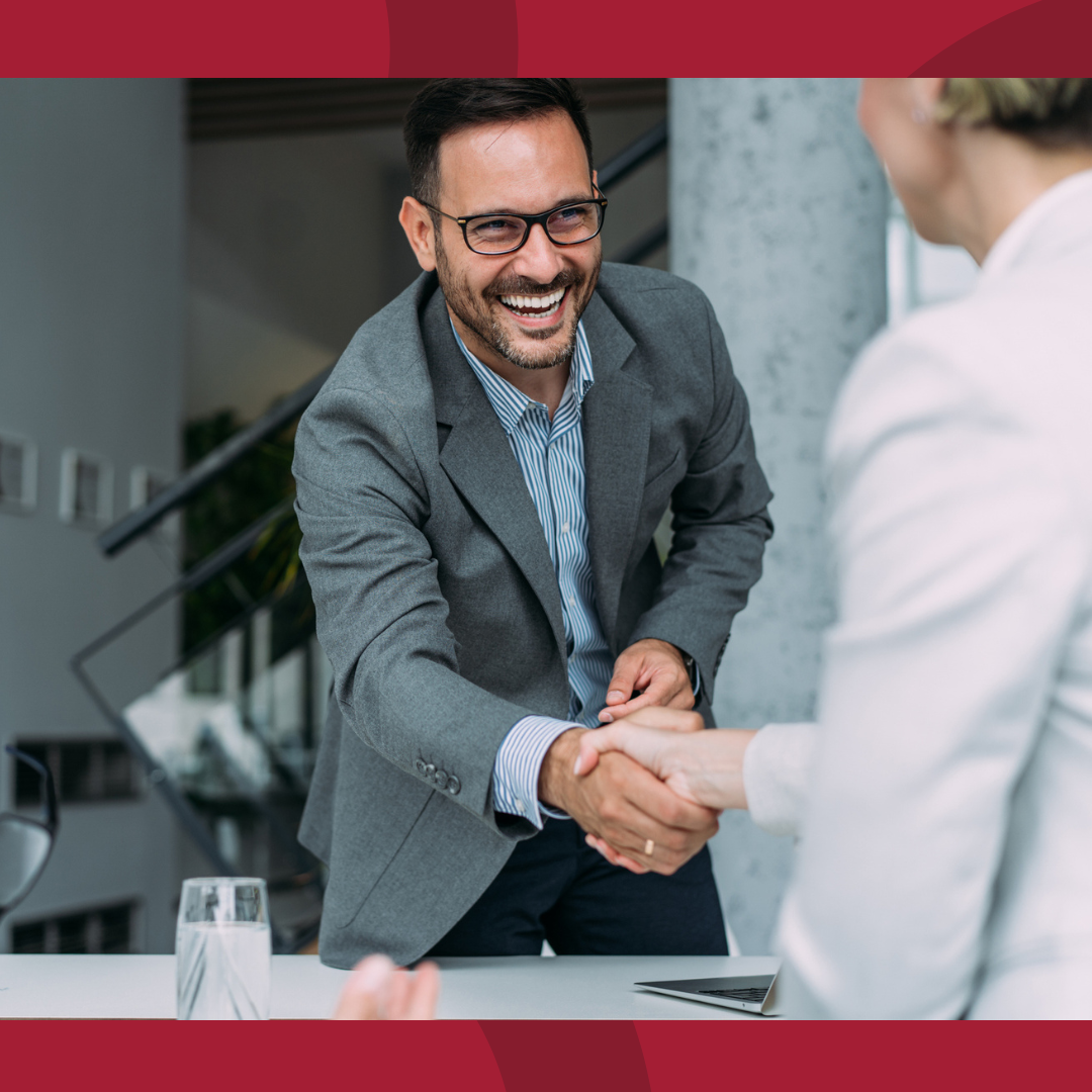 Two business people shaking hands.